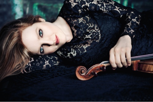 Rachel Pine lying down holding violin